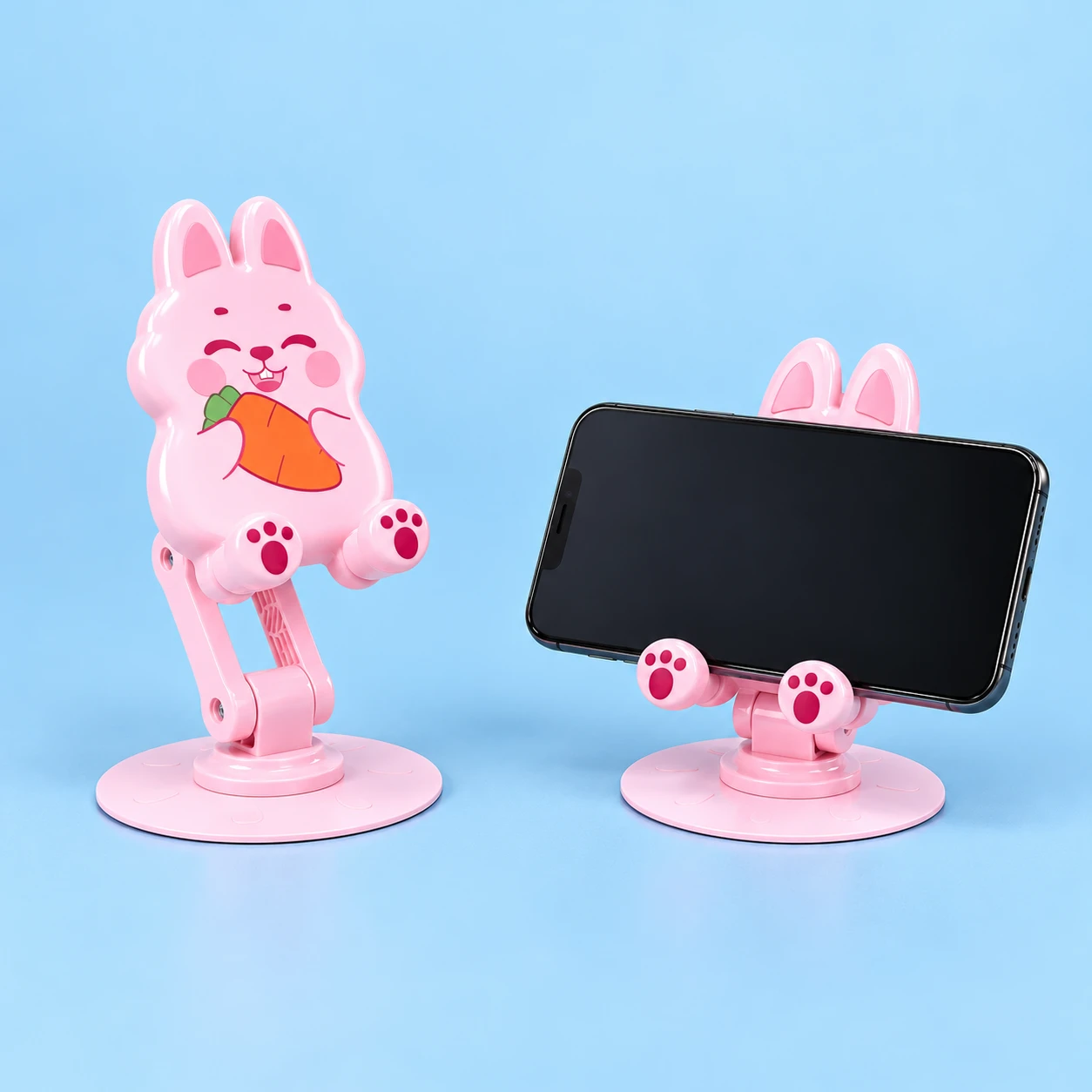 Pink carrot bunny rotating folding phone stand and illustrative landscape cradle use, square composition