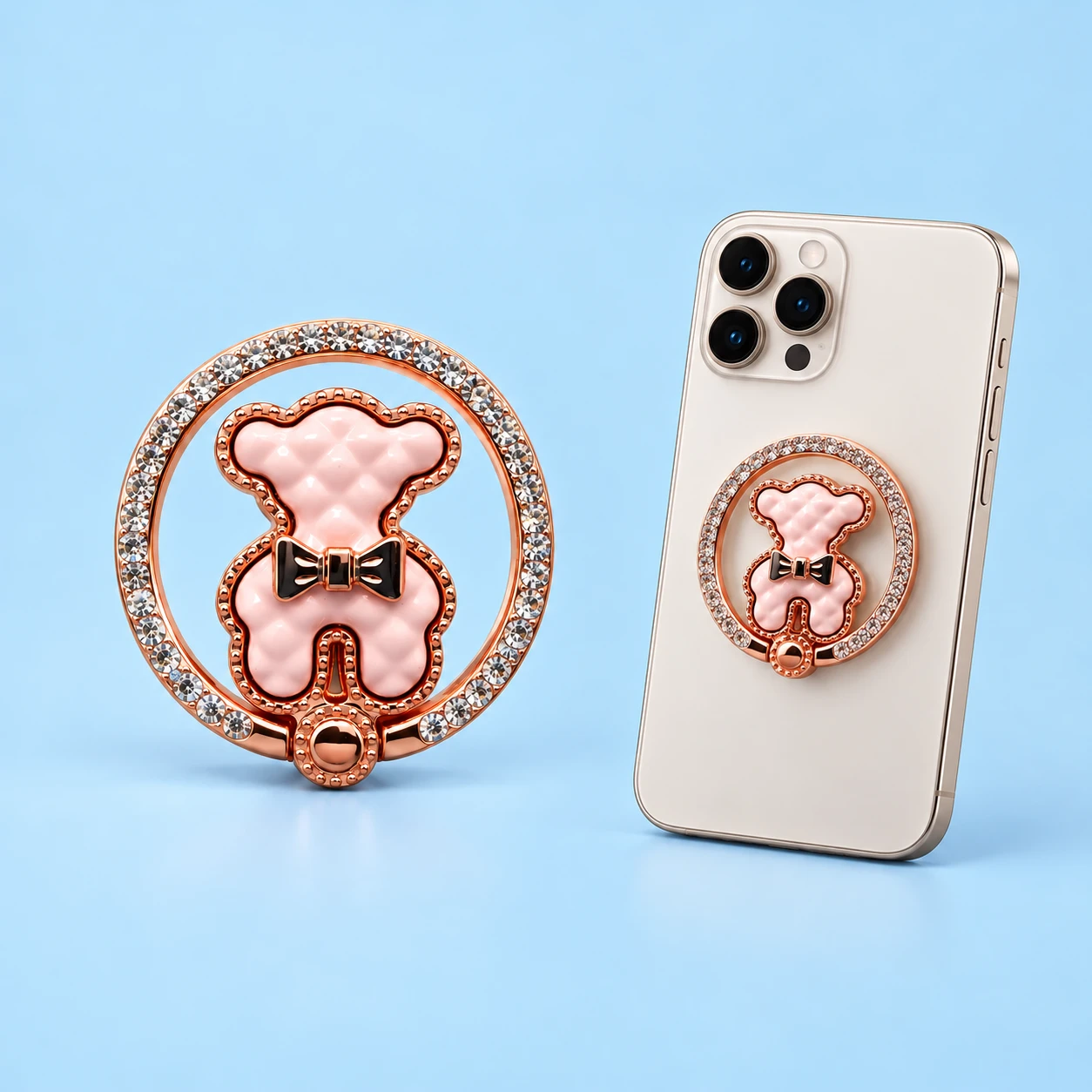 Pink bow-bear phone holder inside a jeweled circular hinged outer ring, square composition