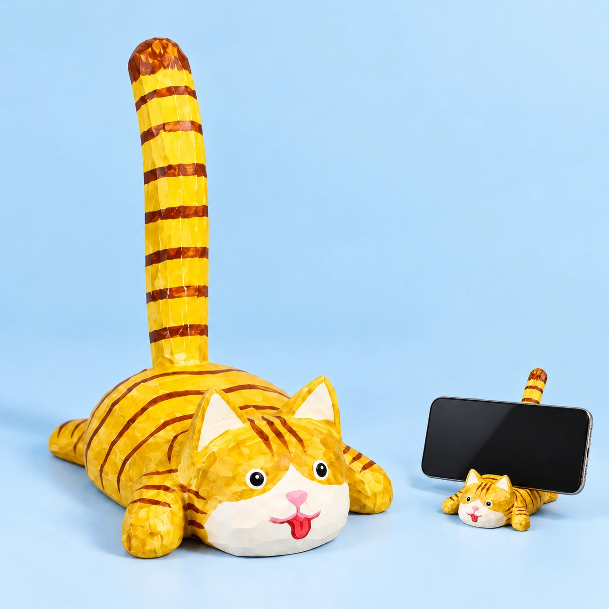Carved cat tail phone stand and illustrative landscape-phone support