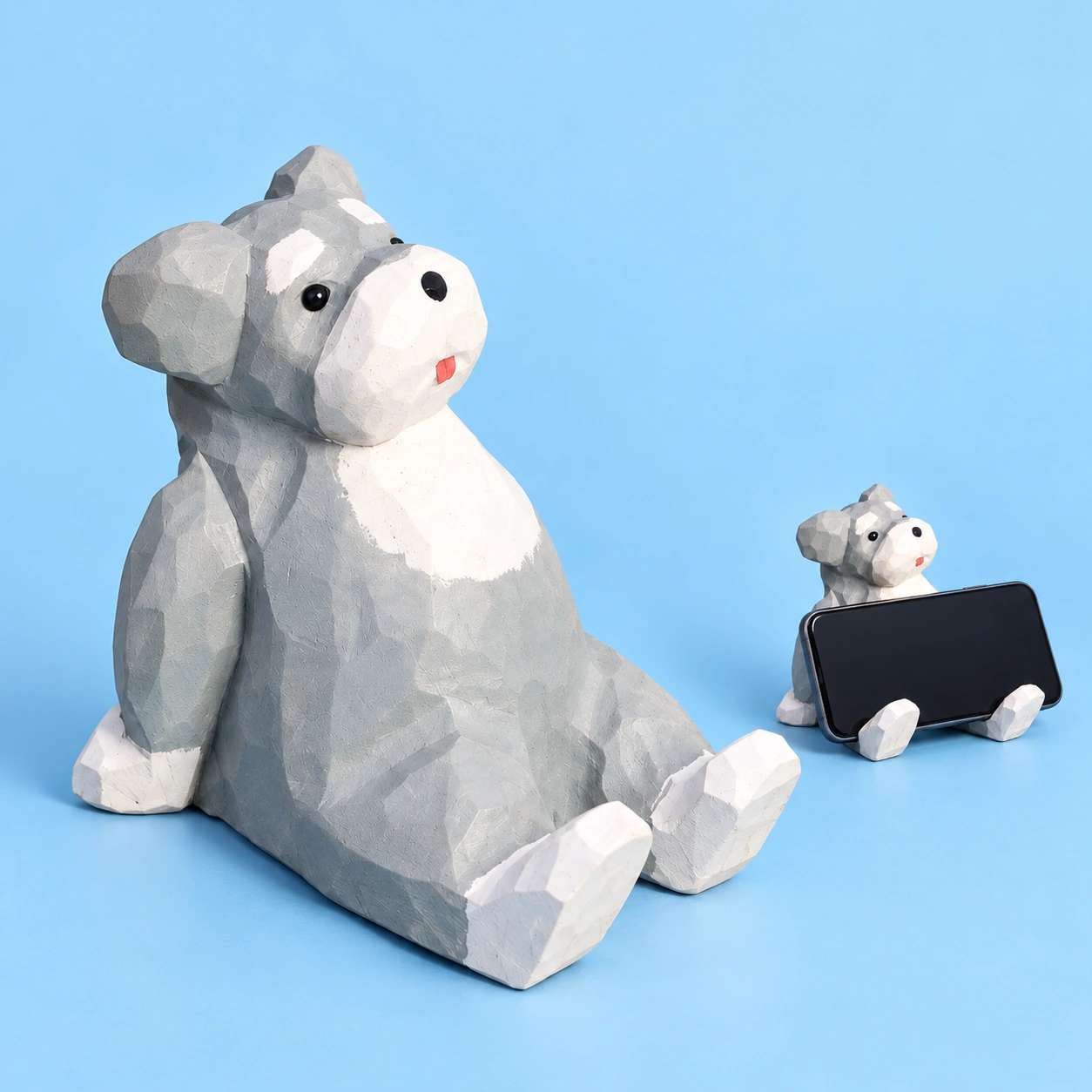 Gray Wooden Puppy Phone Stand shown complete and supporting a landscape phone