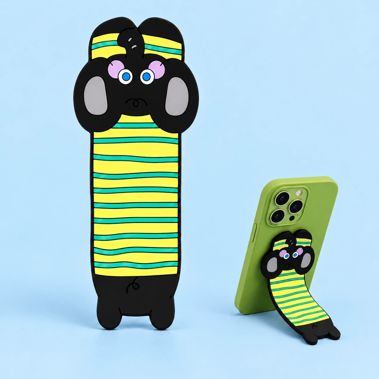 Green-striped black dog bendable phone kickstand shown flat and supporting a portrait phone