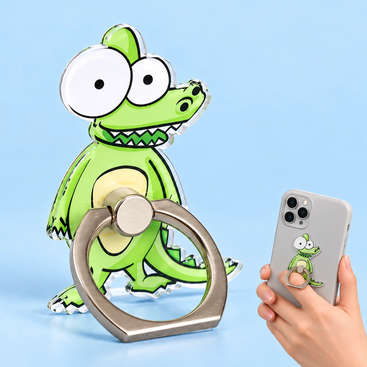 Crocodile phone ring holder shown complete and attached to a hand-held phone