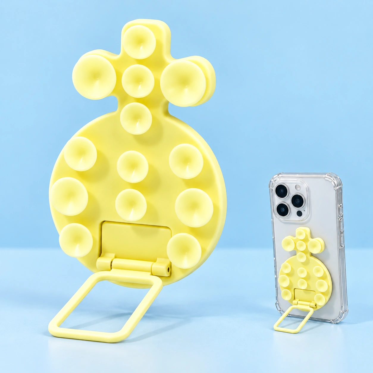 Pastel yellow pineapple-shaped thirteen-cup phone kickstand shown complete and supporting a portrait phone