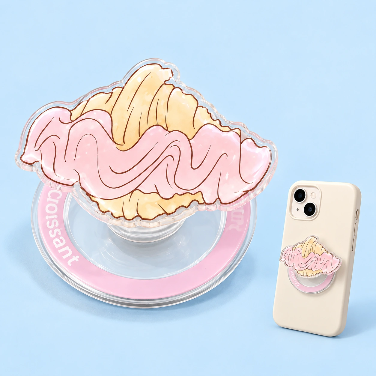 Pink frosted croissant magnetic phone grip shown complete and flat-mounted on a phone