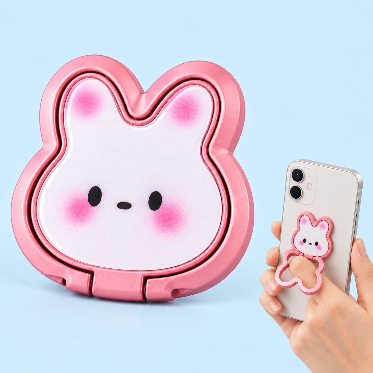Pink bunny folding phone ring holder, closed complete product left and opened outline ring around a finger on held phone right; phone not included