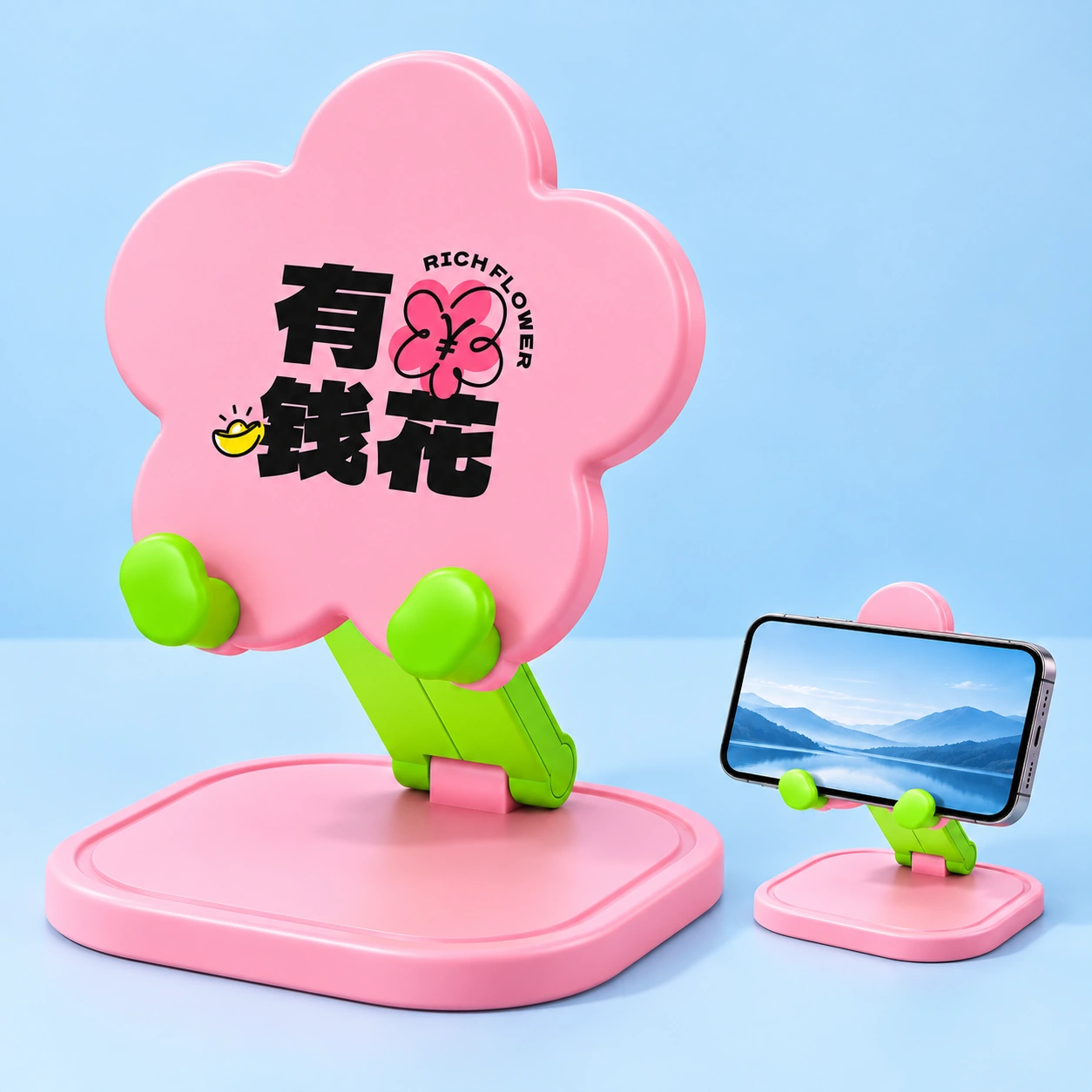Pink flower folding desk phone stand, complete product left and landscape phone in cradle right on pale blue; phone not included