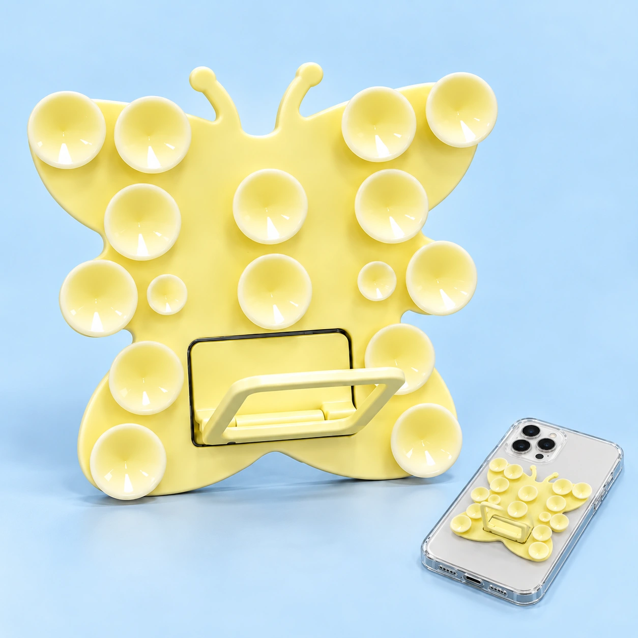 Cream yellow butterfly suction phone kickstand and illustrative rear phone mounting