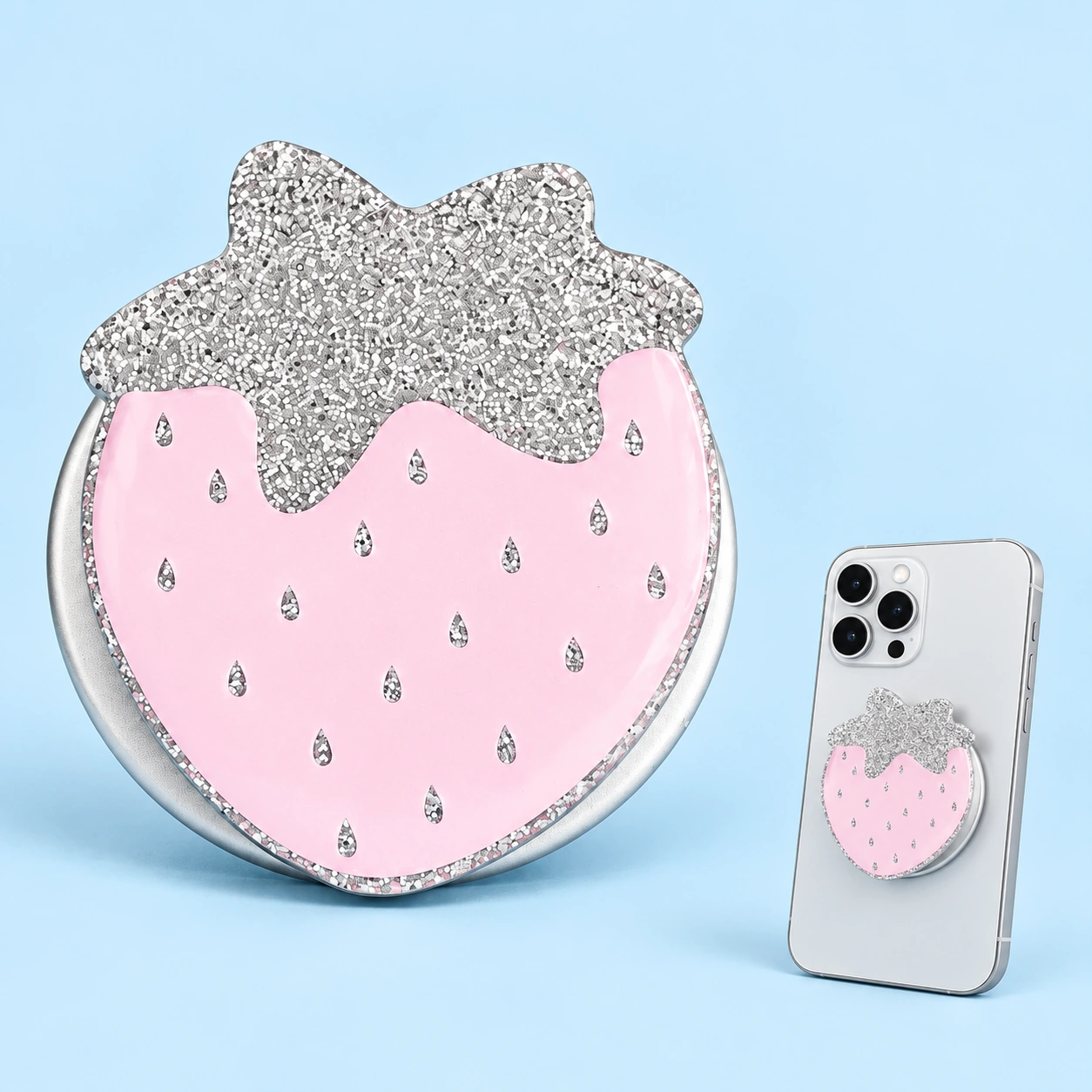 Pink glitter strawberry magnetic expandable phone grip shown complete and mounted flat on a phone