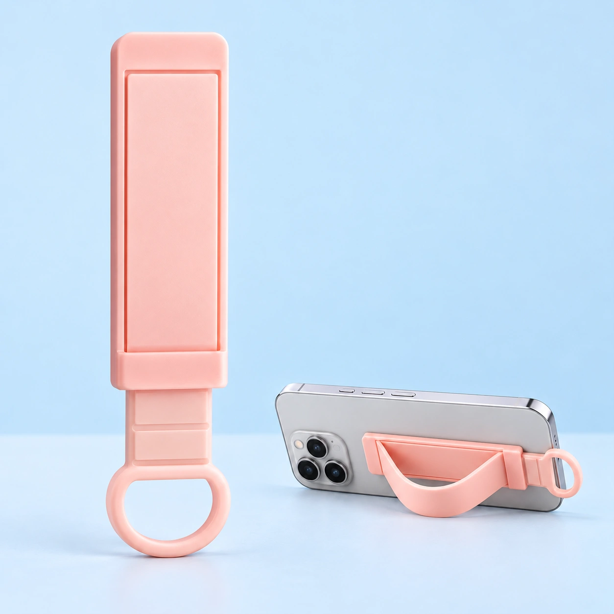 Pastel pink sliding D-loop phone grip strap and landscape support illustration