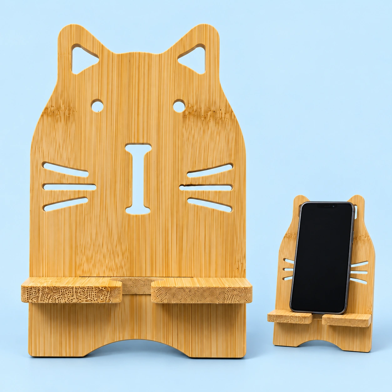Bamboo whisker-cutout cat phone stand with split front shelf and illustrative portrait phone support