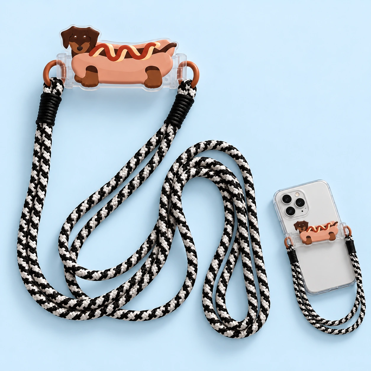 Hotdog dachshund decorative phone clamp with black-and-white lanyard, shown complete and attached to a phone case