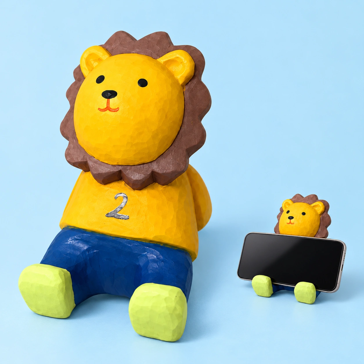 Yellow Wooden Lion Phone Stand shown complete and supporting a landscape phone