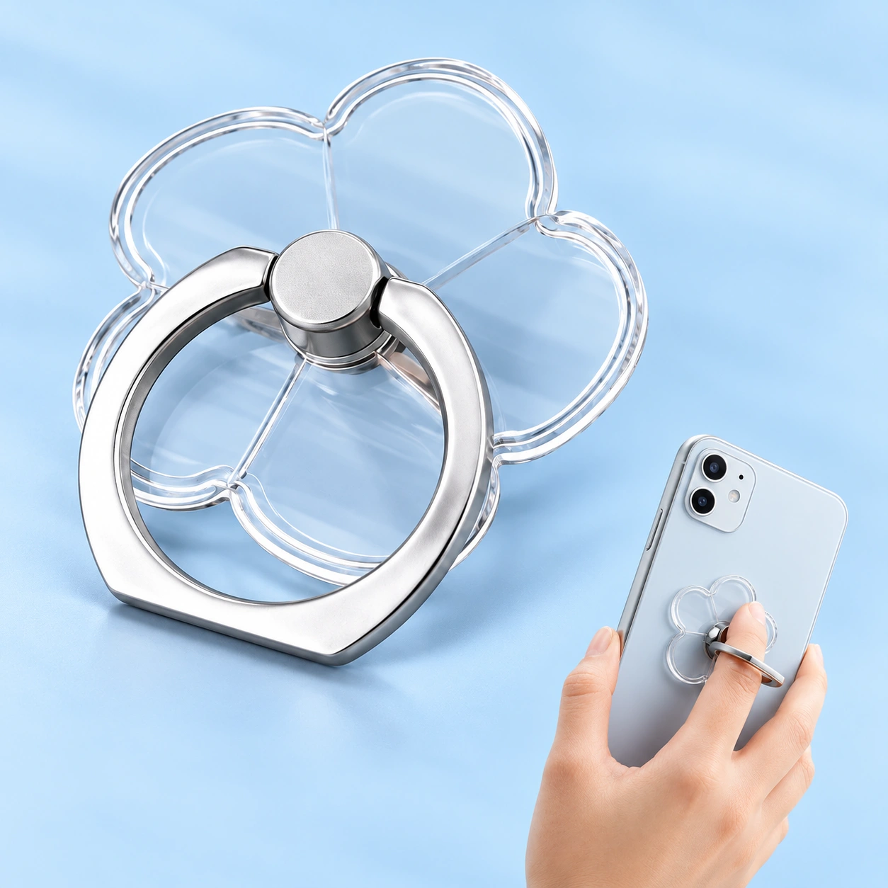 Clear five-petal flower phone ring holder shown complete and in finger-grip use