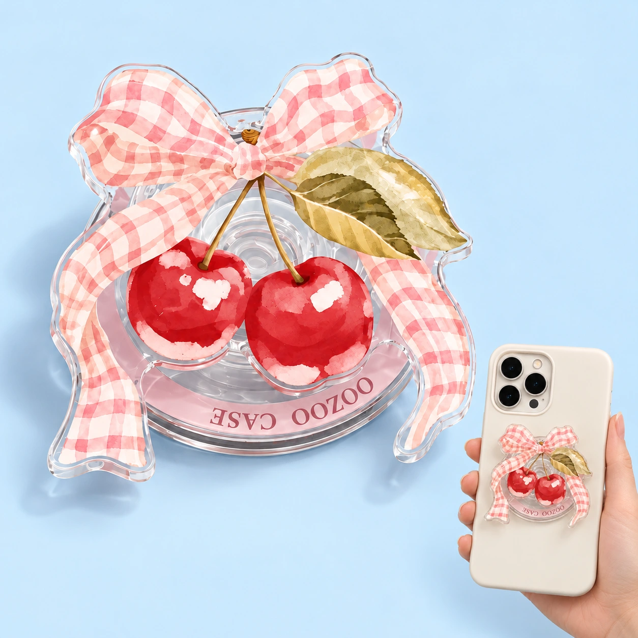 Pink gingham bow and cherry magnetic phone grip shown complete and flat-mounted on a phone
