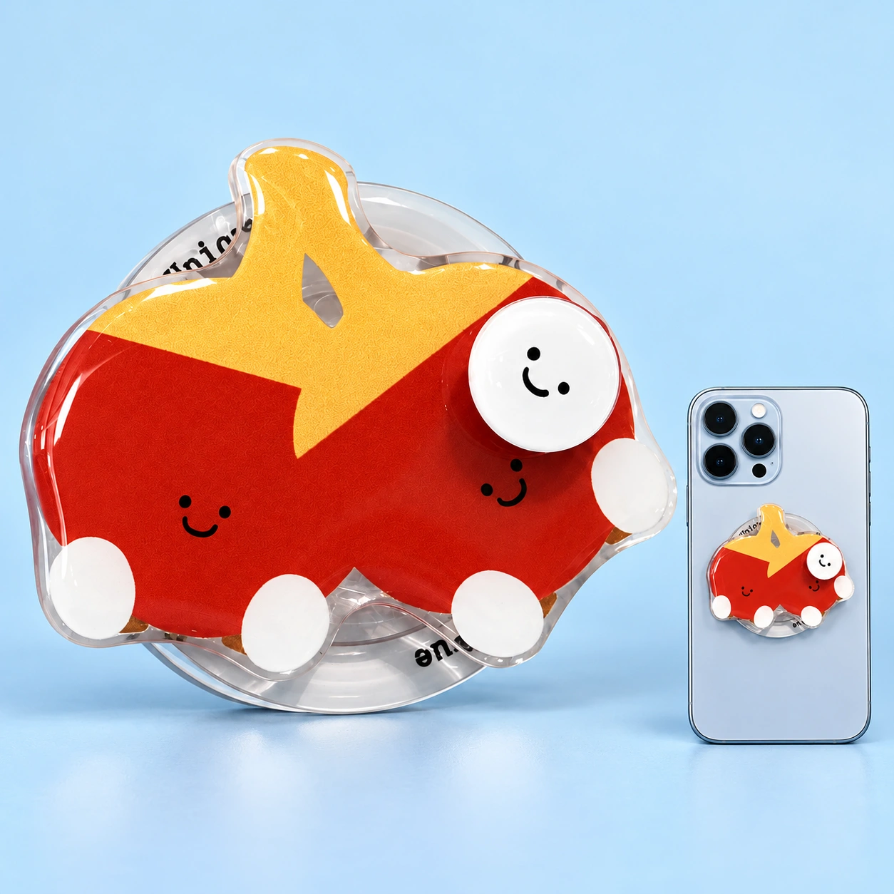 Twin smiling red table-tennis paddle phone grip, shown complete and flat-mounted on a phone