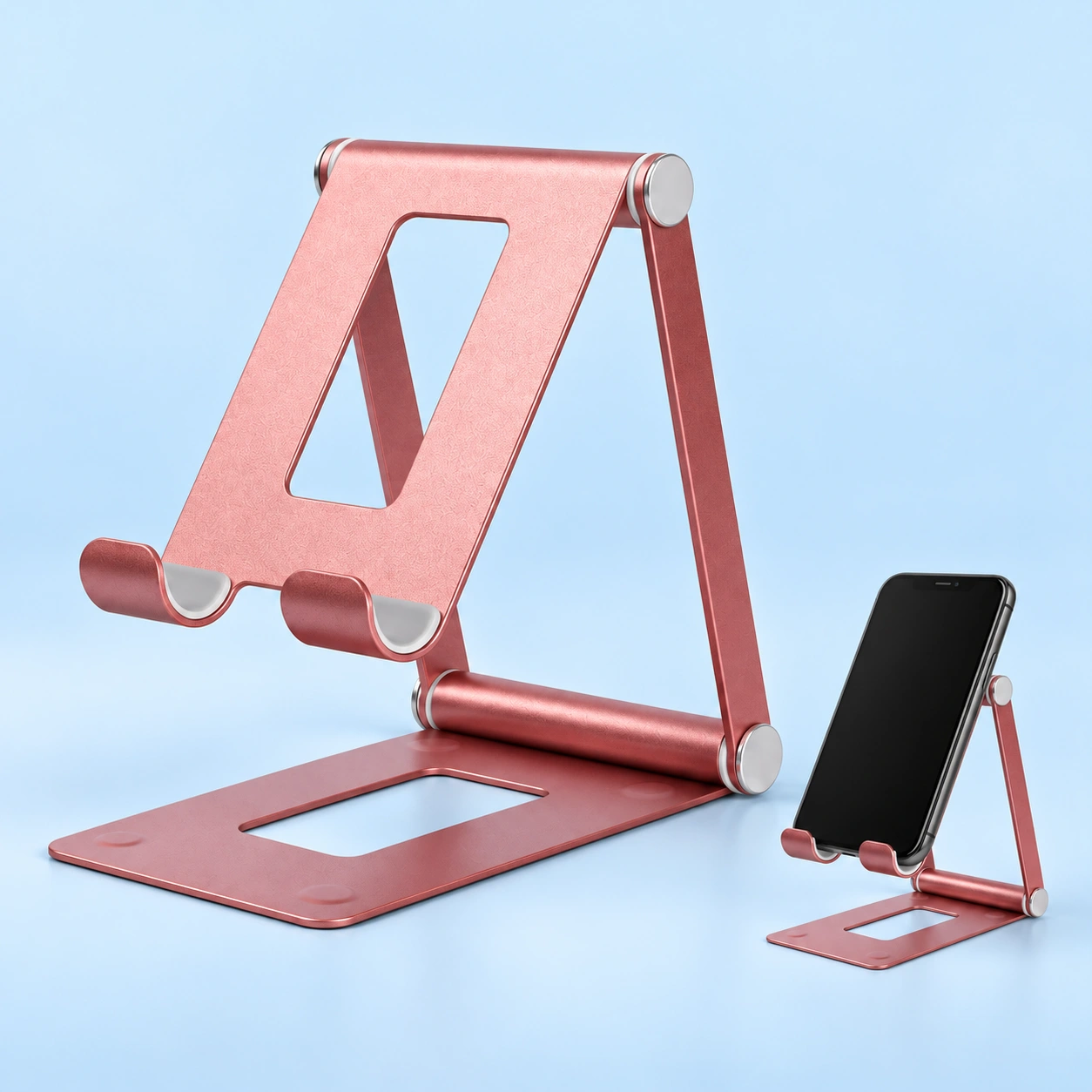 Pink open-bar folding metal phone stand shown complete and supporting a portrait phone