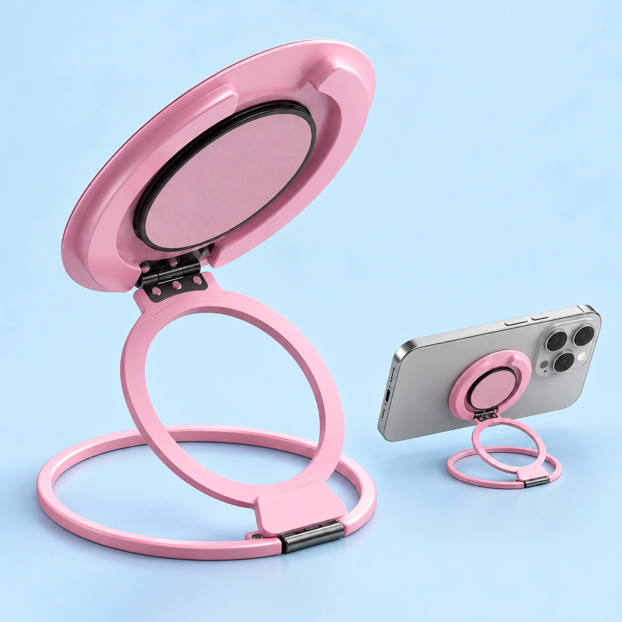 Pink three-fold magnetic phone ring stand, shown open and supporting a landscape phone