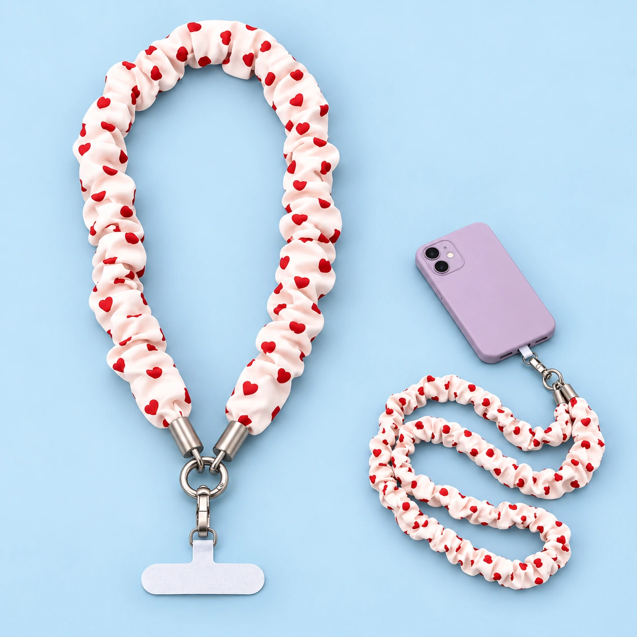 Red heart gathered-fabric phone lanyard with included tether tab and illustrative phone-case attachment