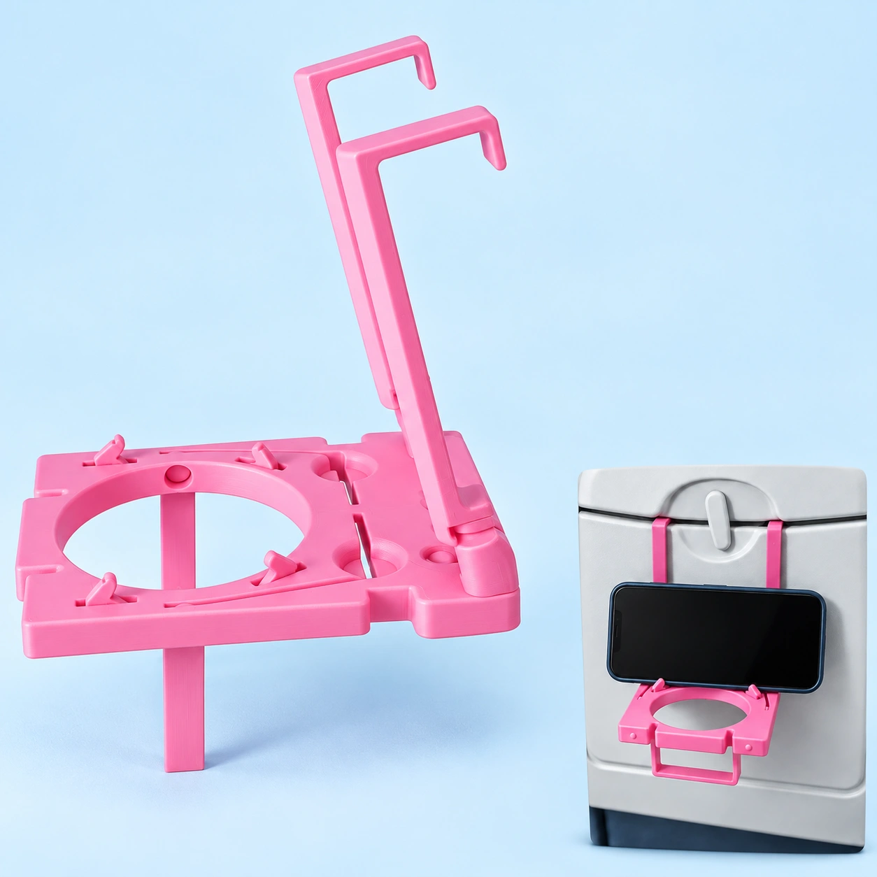 Pink folding tray-hook airplane phone holder shown complete and holding a landscape phone on a suitable stowed tray