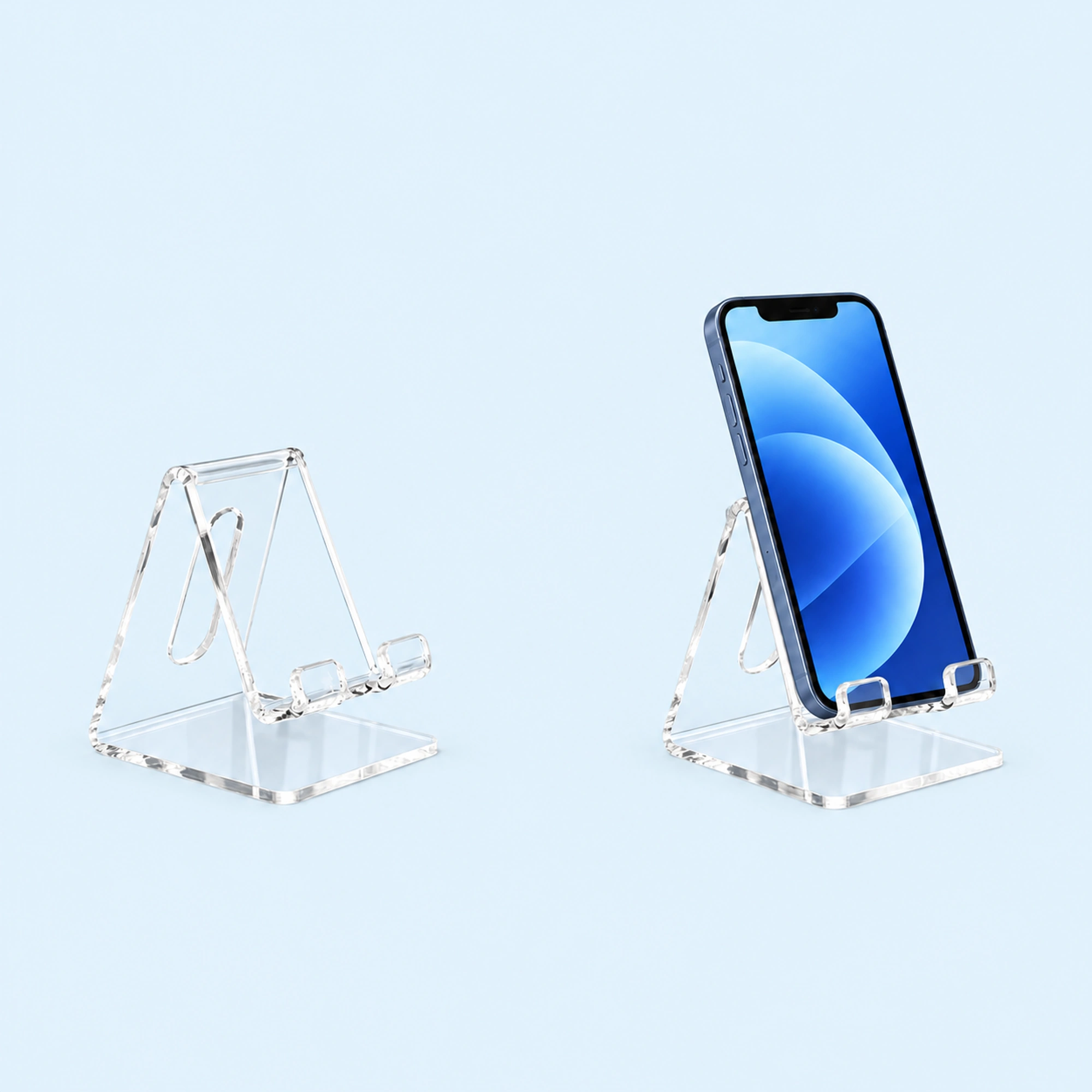 Clear Open-Back Phone Display Stand shown in use on a light blue background; demonstration device not included