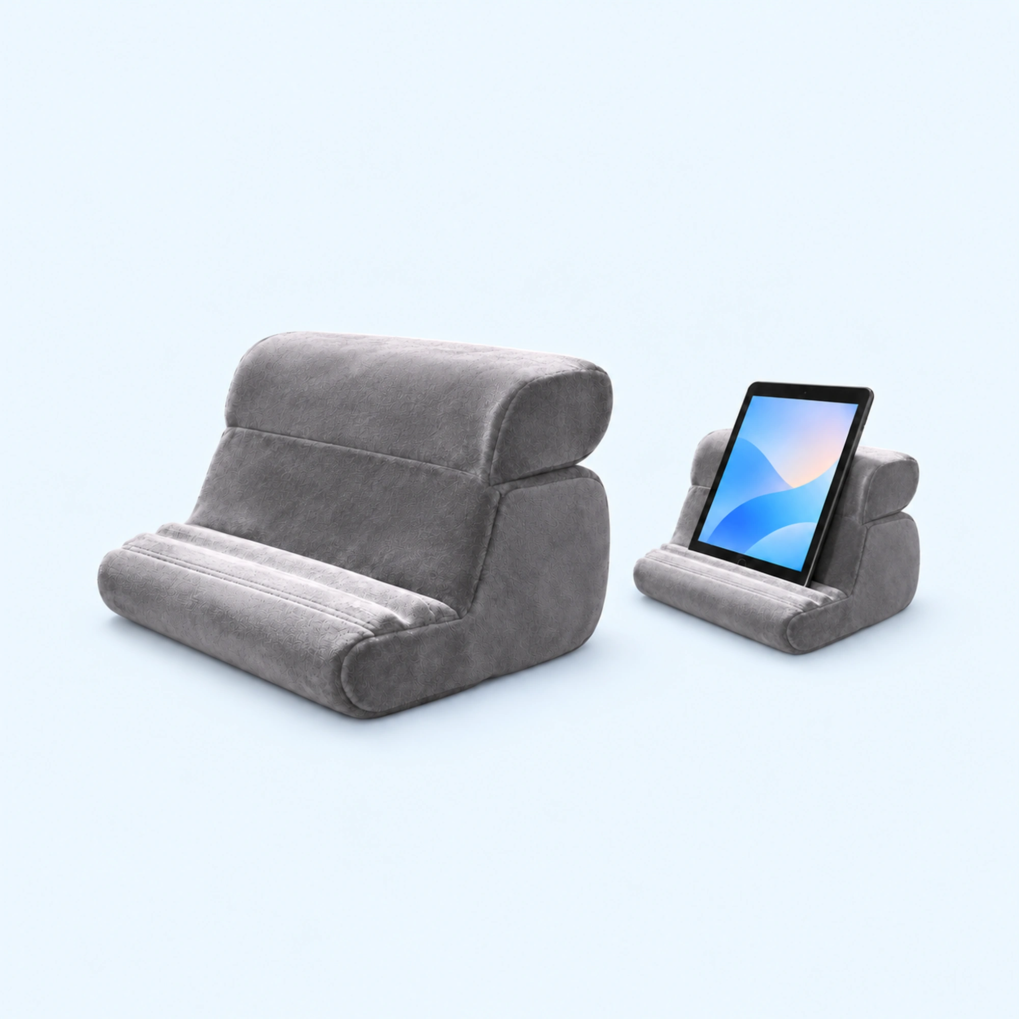 Gray Padded Cushion Phone and Tablet Stand — complete product and example of use on a pale blue background