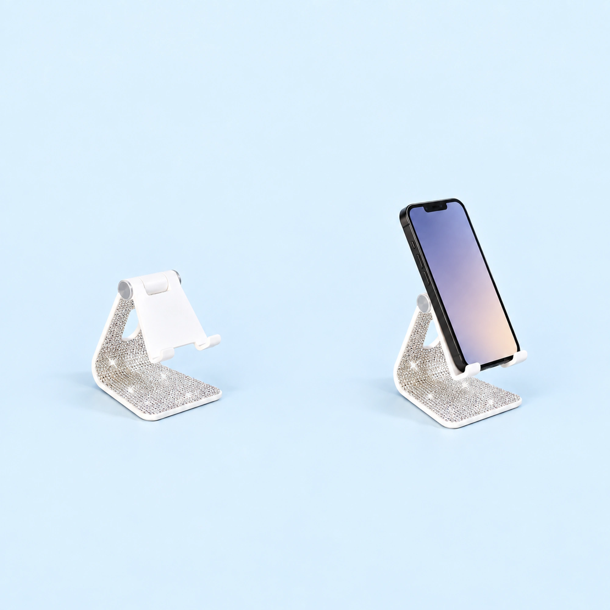 Crystal-Trim Folding Phone Stand shown in use on a light blue background; demonstration device not included