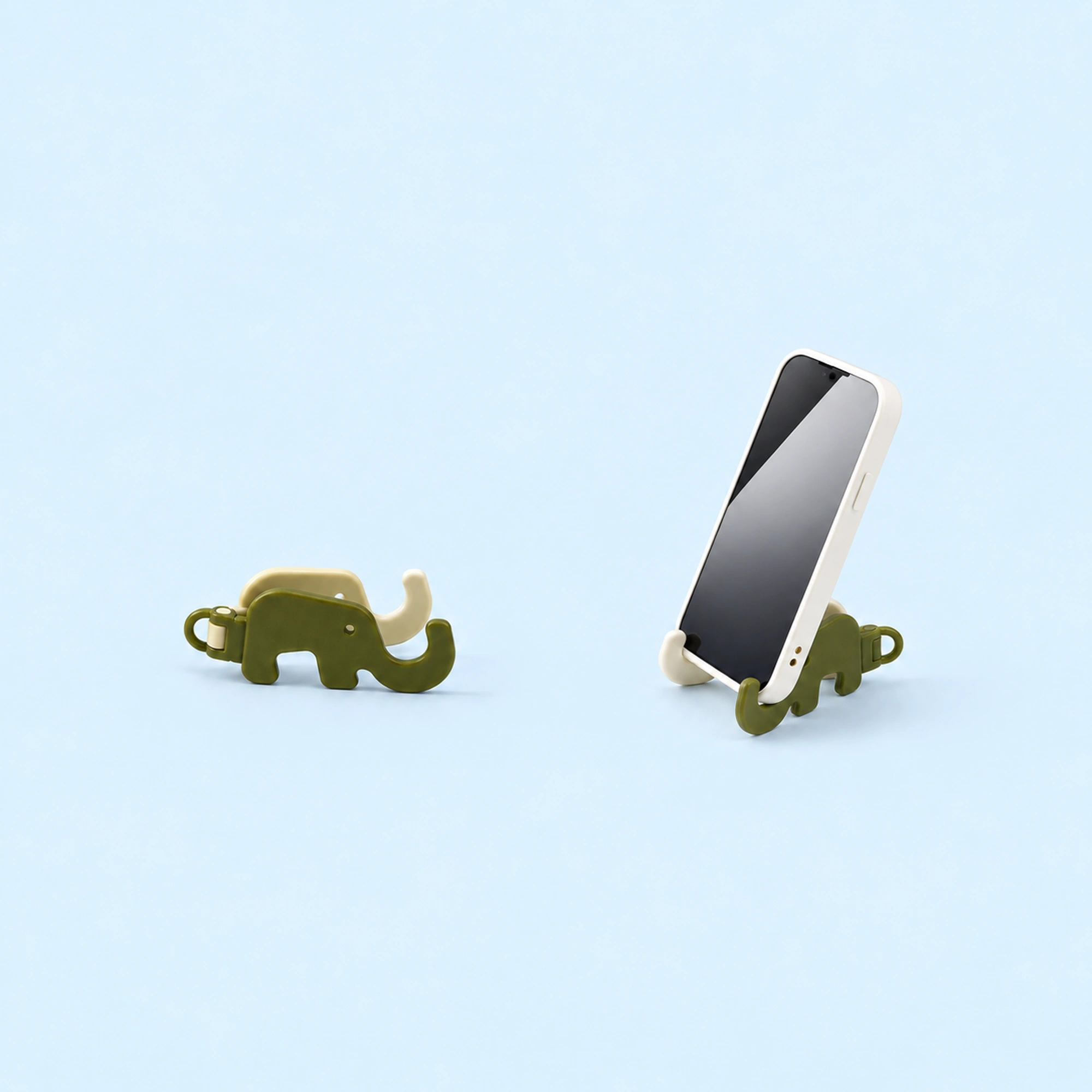 Two-Part Elephant Pocket Phone Stand shown in use on a light blue background; demonstration device not included