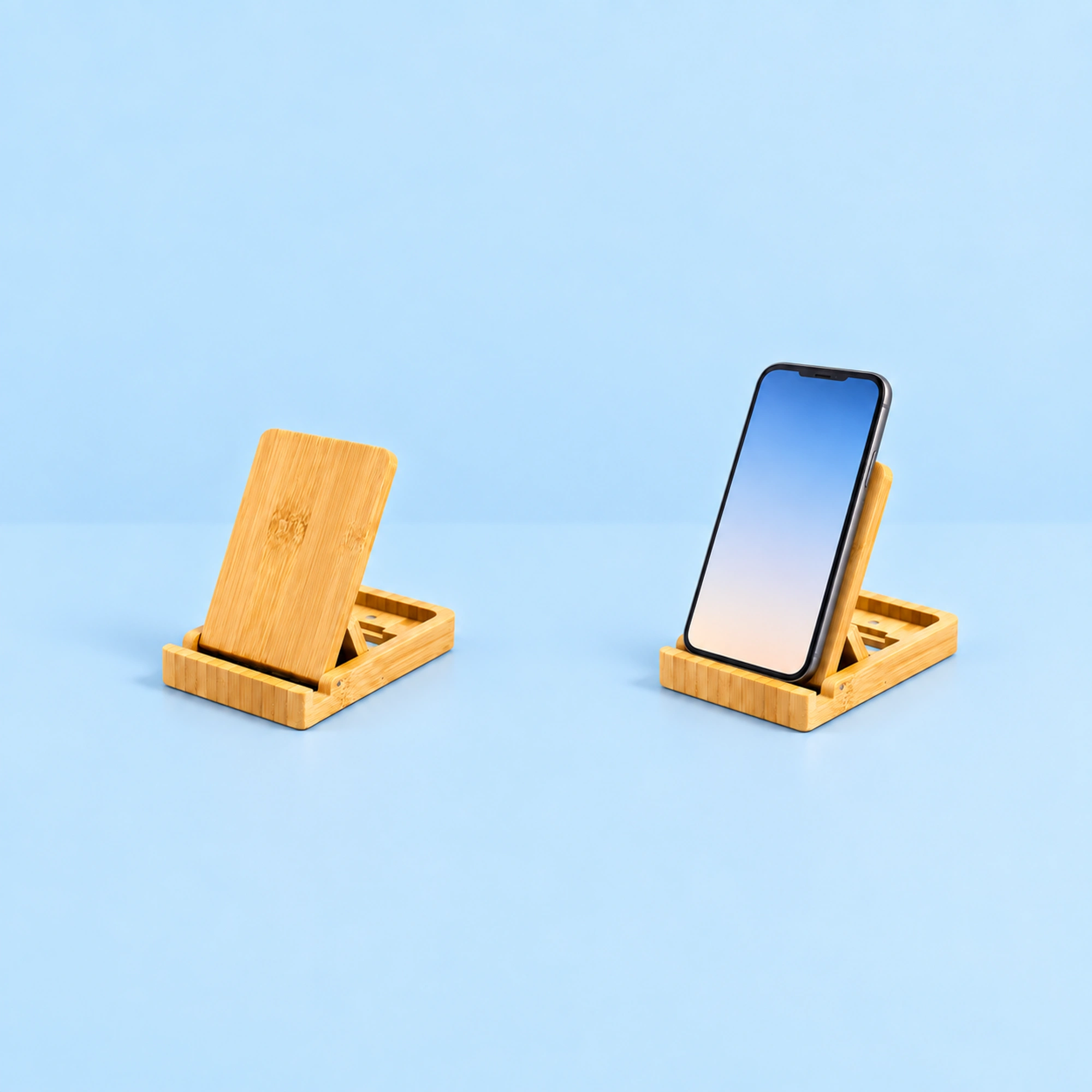 Flat-Folding Bamboo Adjustable Phone Stand shown in use on a light blue background; demonstration device not included